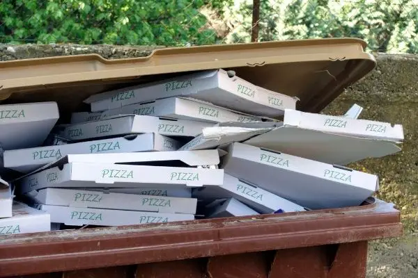 Pile of pizza boxes in compost bin