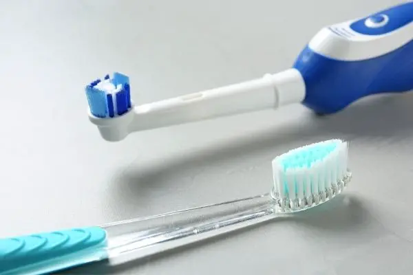 electric toothbrush and plastic toothbrush
