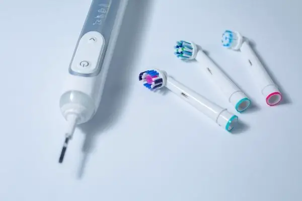 electric toothbrush with separate toothbrush heads