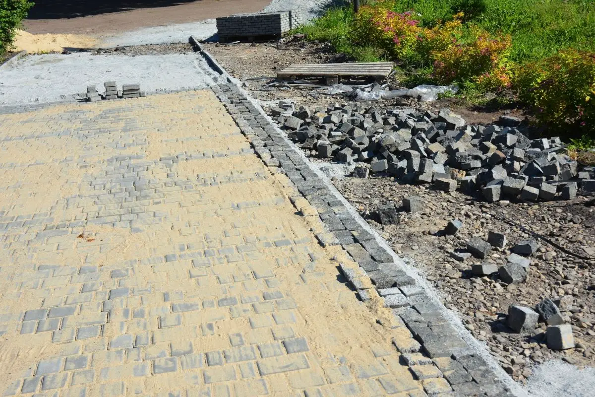 Polymeric Sand vs Regular Sand for Pavers — Which is Better for Your Paving Project
