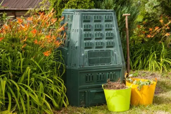 large compost bin in a garden