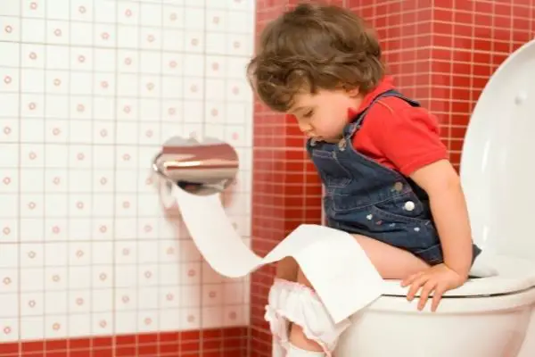 child using toilet