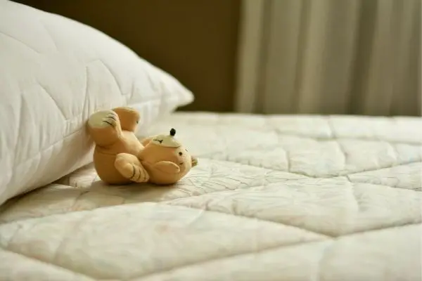 stuffed toy on bed