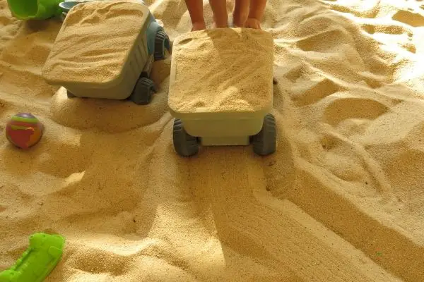 sandbox with construction toys