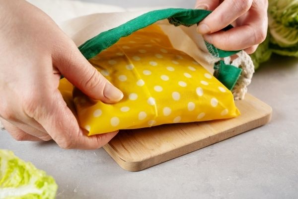 Packing Away Food Wrapped In Reusable Beeswax Cloth