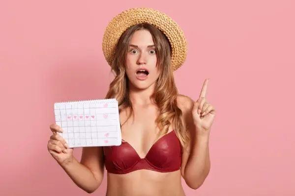 Woman wearing swimsuit on her period