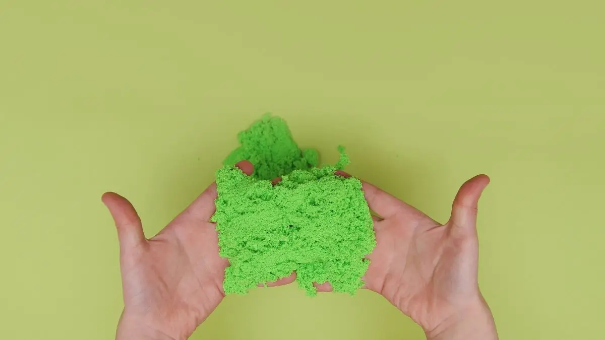 Green Kinetic Sand In Hands