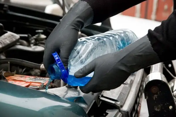 Pouring Automotive Fluid In Car Machine