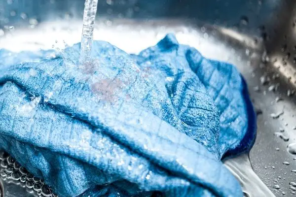 Running Water On Stained Clothes