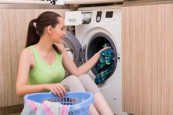Wife Doing Laundry To Get Starch Out Of Clothes