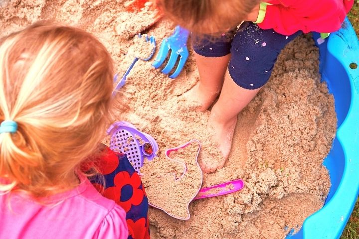 Kids Playing In Sandbox