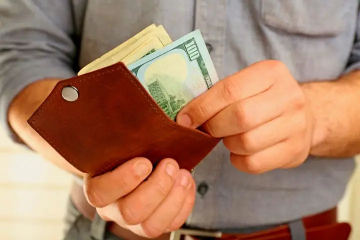 Man Is Holding Wallet
