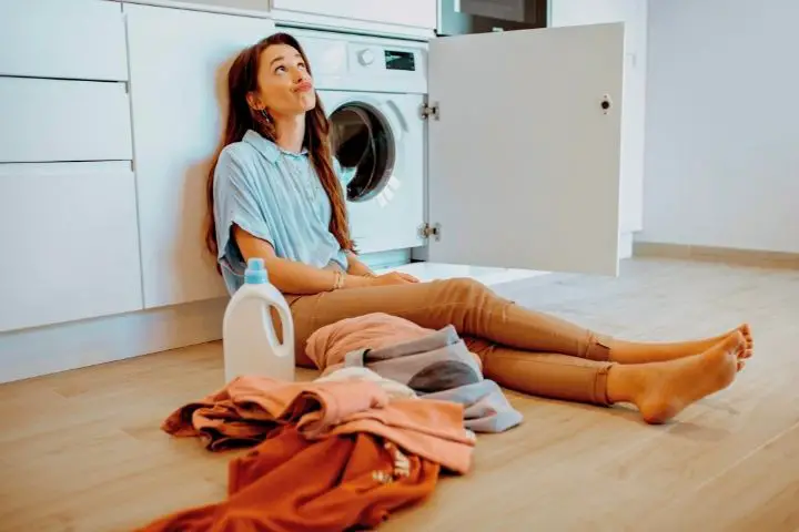 The Girl Leaned Next To Washing Machine