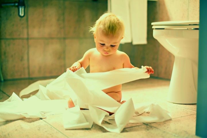 Baby Is Playing With Toilet Paper
