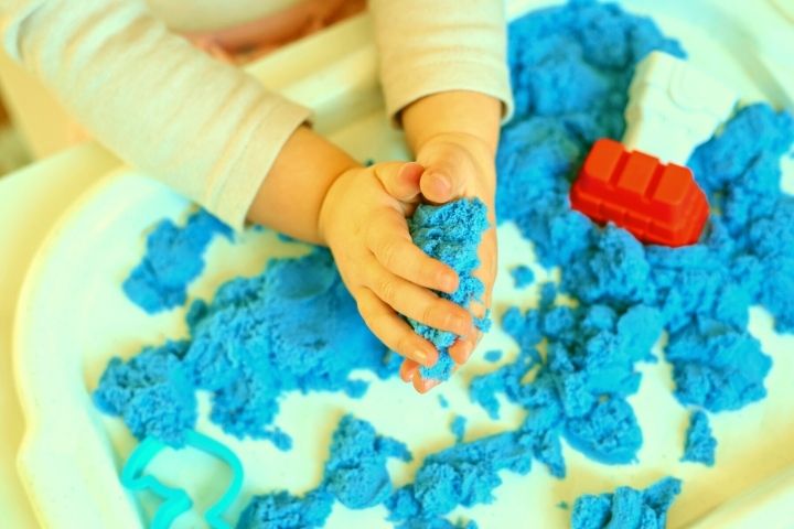 Baby's Playing With Kinetic Sand