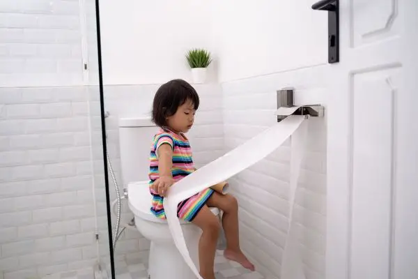 Child Pulling Toilet Paper