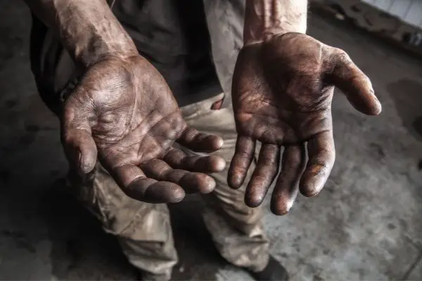 Hands Covered In Black Dirt From Smoke