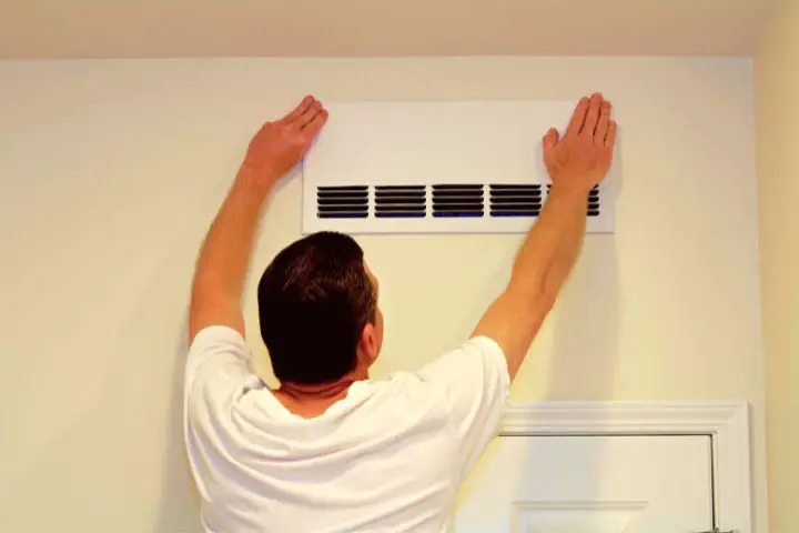 Man Is Fixing Air Vent At Home