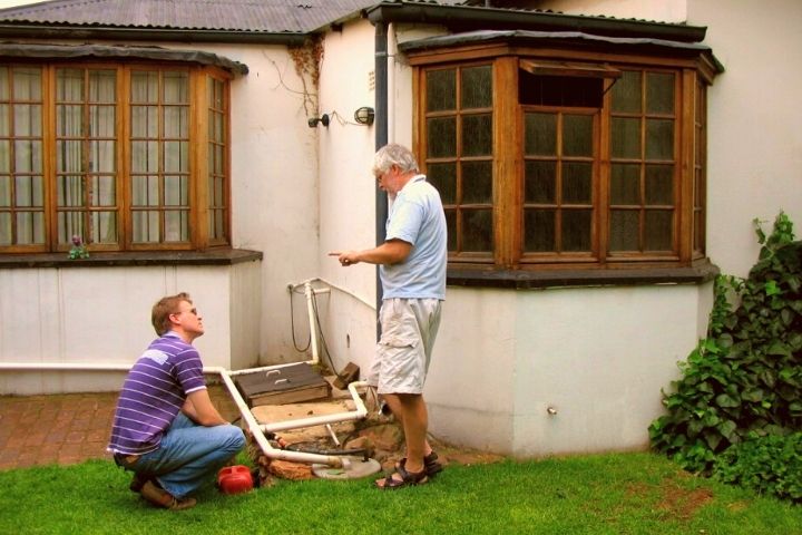 Men Install Grey Water System