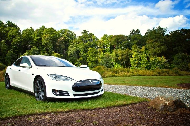 Tesla On The Background Of A Beautiful Landscape