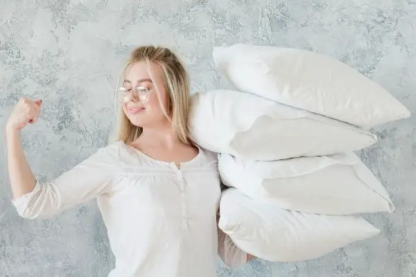 Woman Holding Pillows