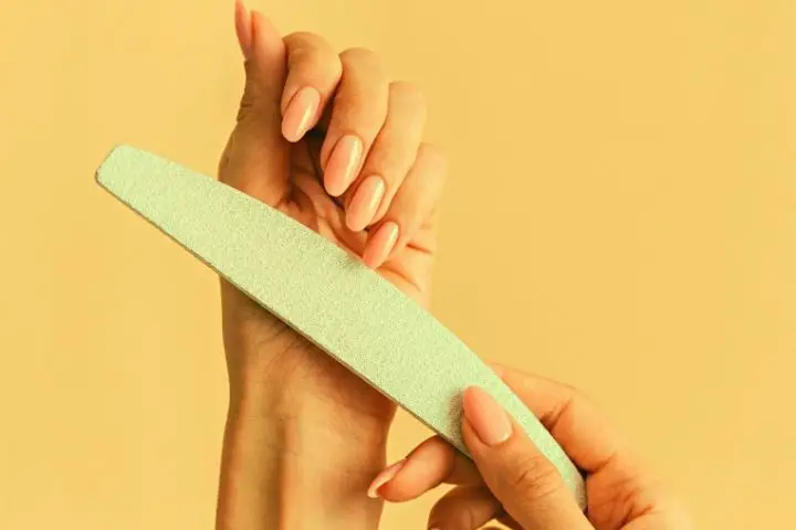 Woman Holds Nail Filer