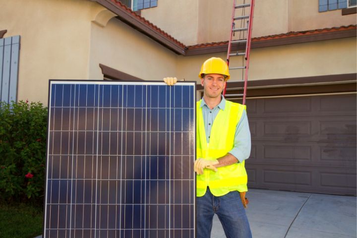 Installer Man Holds Solar Panel