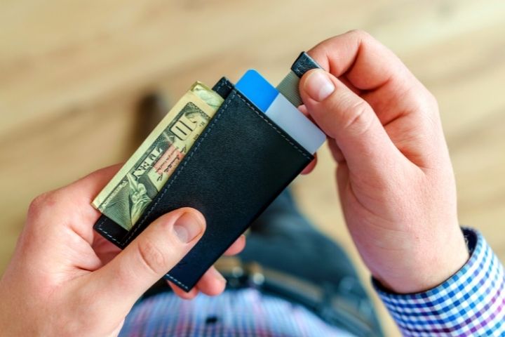 Man With Wallet In Hands