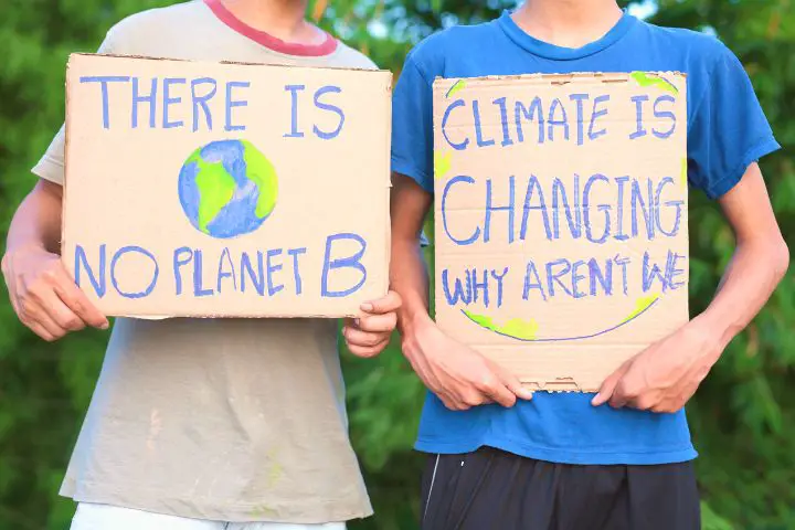 Children With Signs Encouraging To Take Care Of The Planet