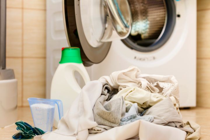 Laundry Detergent Next To Dirty Clothes