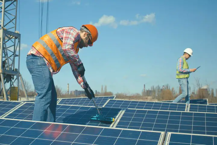 Man Cleaning Solar Panels