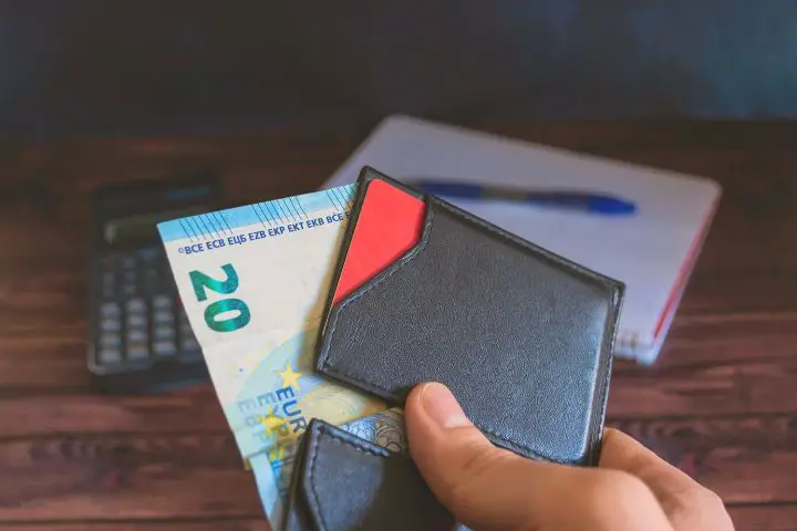 Man With Money In Wallet