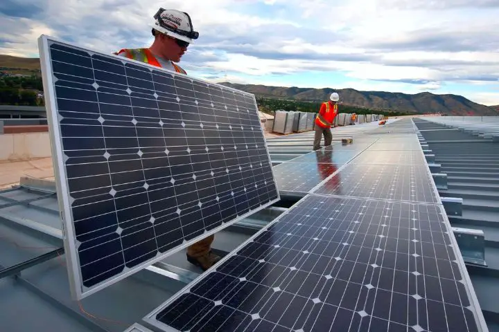Men Are Installing Black Solar Panels