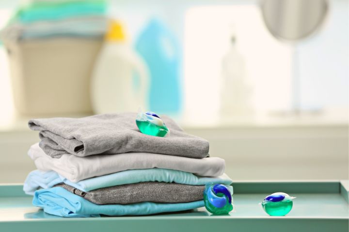 Detergent Pods Next To Clean Clothes