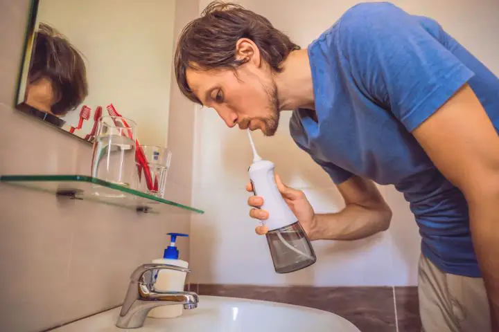 Man With Oral Irrigator