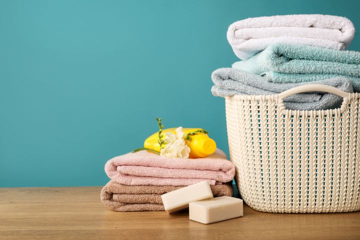 pile of towels and laundry basket