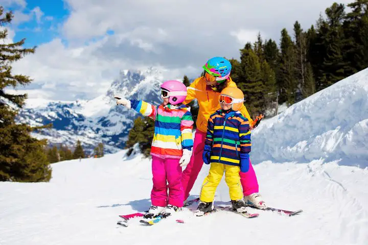 Father With Kids Skiing