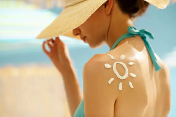 Woman With Sunscreen On Her Skin