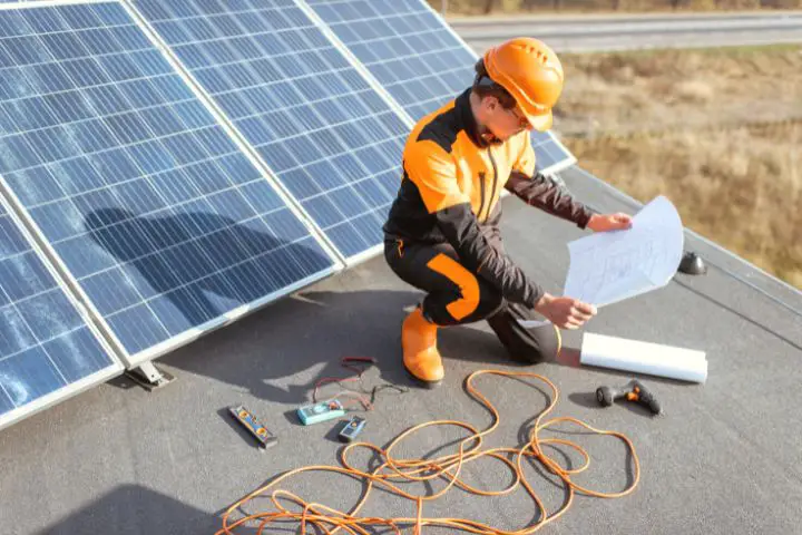 Man Installs Solar Panels 
