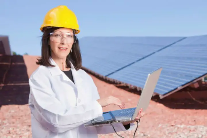 Woman Controls The Operation Of Solar Panels