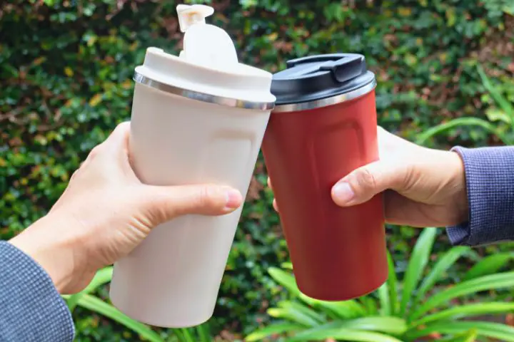 Hands Holding Reusable Thermos