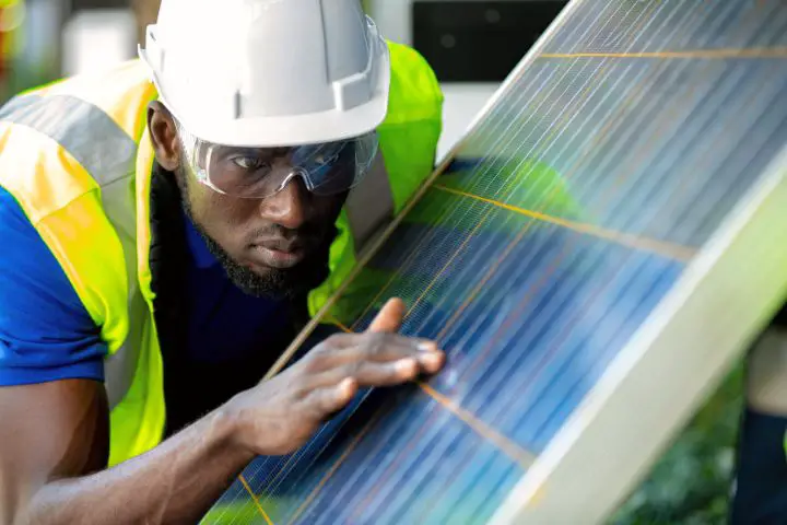 Man Checking Impact Resistant Solar Panel