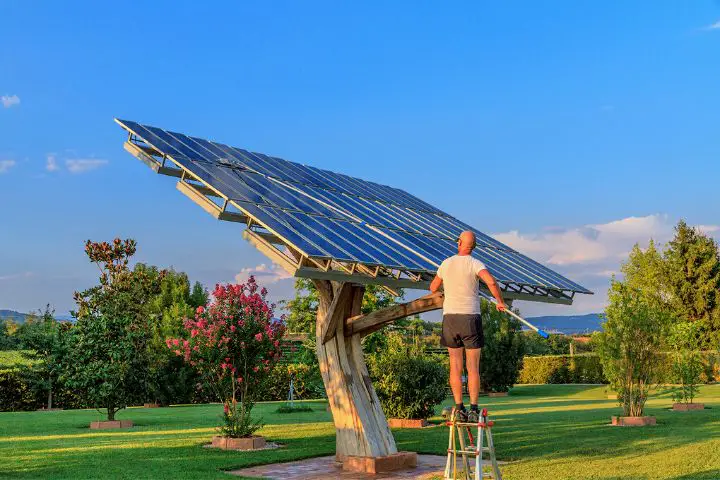 Man Is Cleaning Solar Panels
