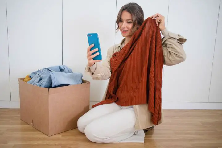 Woman Donating Decluttered Clothes Online