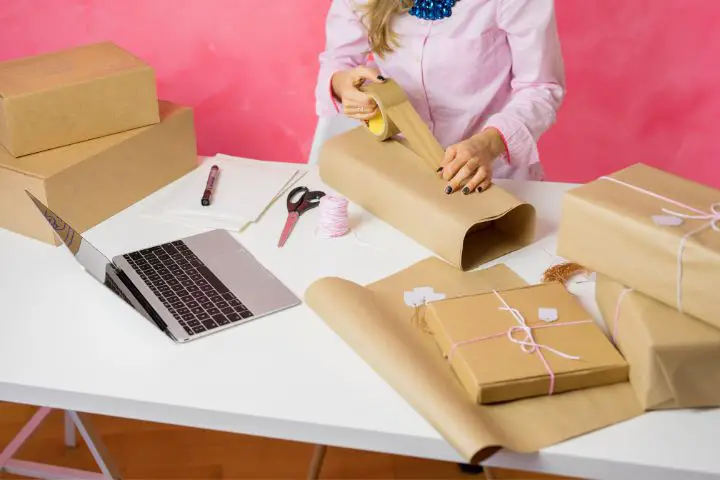 Woman Selling Items Online And Packaging Goods For Shipping
