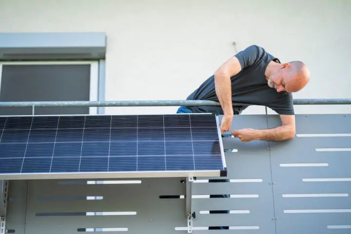 Man Installs Plug In Balcony Solar Module