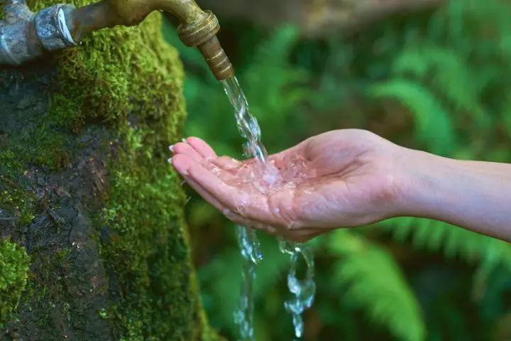 Man Washing Hands With Clean Water