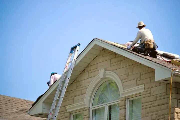 Men Determine The Orientation And Angle Of The Roof