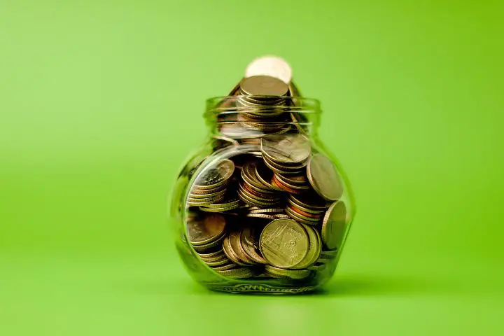 Savings A Lot Of Coins On Green Background