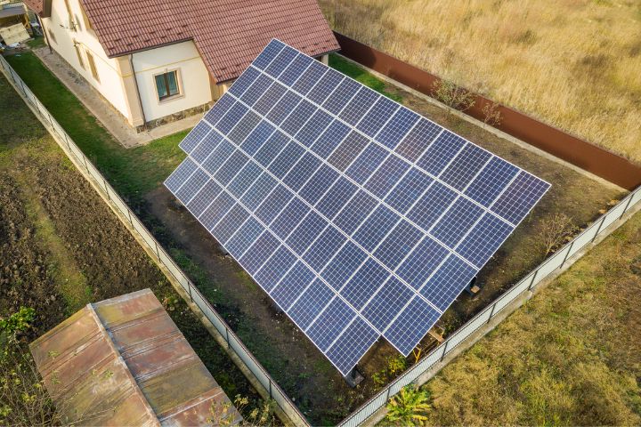 Aerial View Of Big Blue Solar Panel Installed On Ground Structur